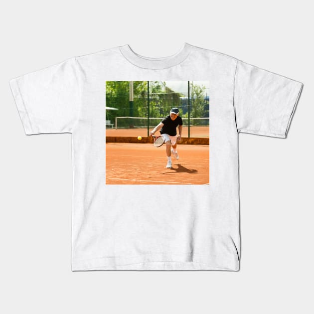 Active senior man playing tennis (F024/8848) Kids T-Shirt by SciencePhoto